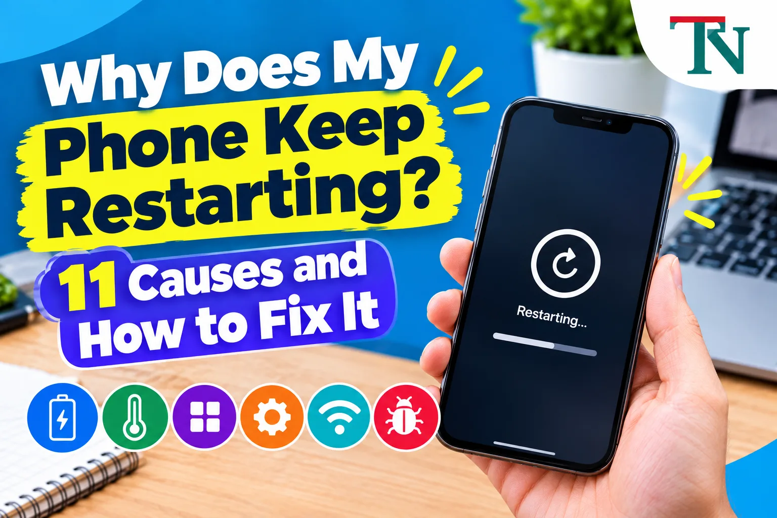 Hand holding a phone that shows a restarting screen with a circular arrow