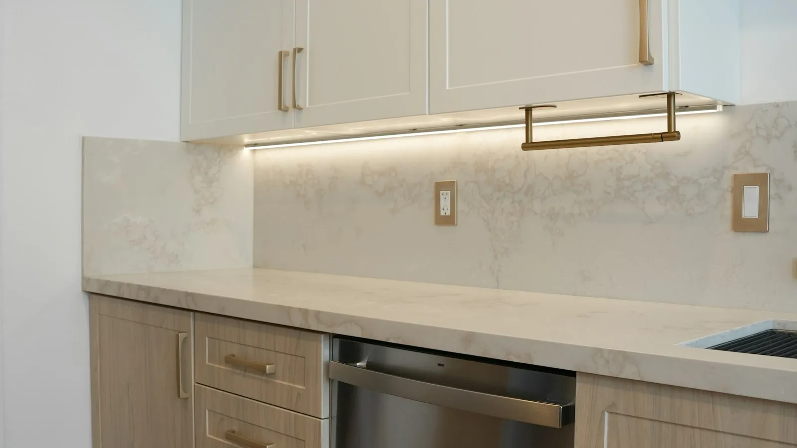 A kitchen counter with a built-in dishwasher below it