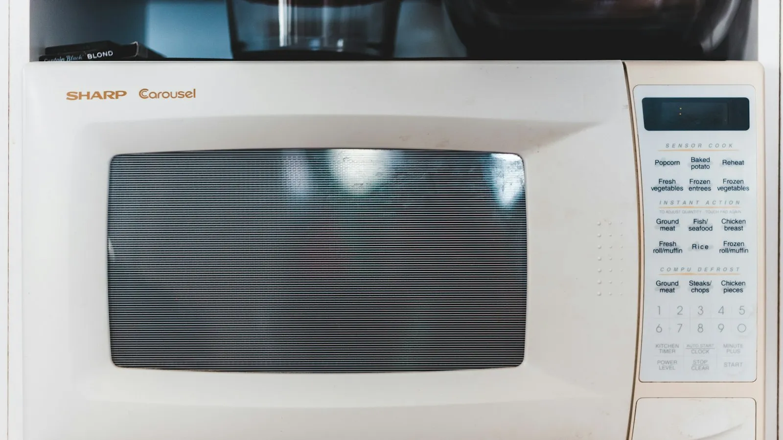 White microwave oven with its door closed