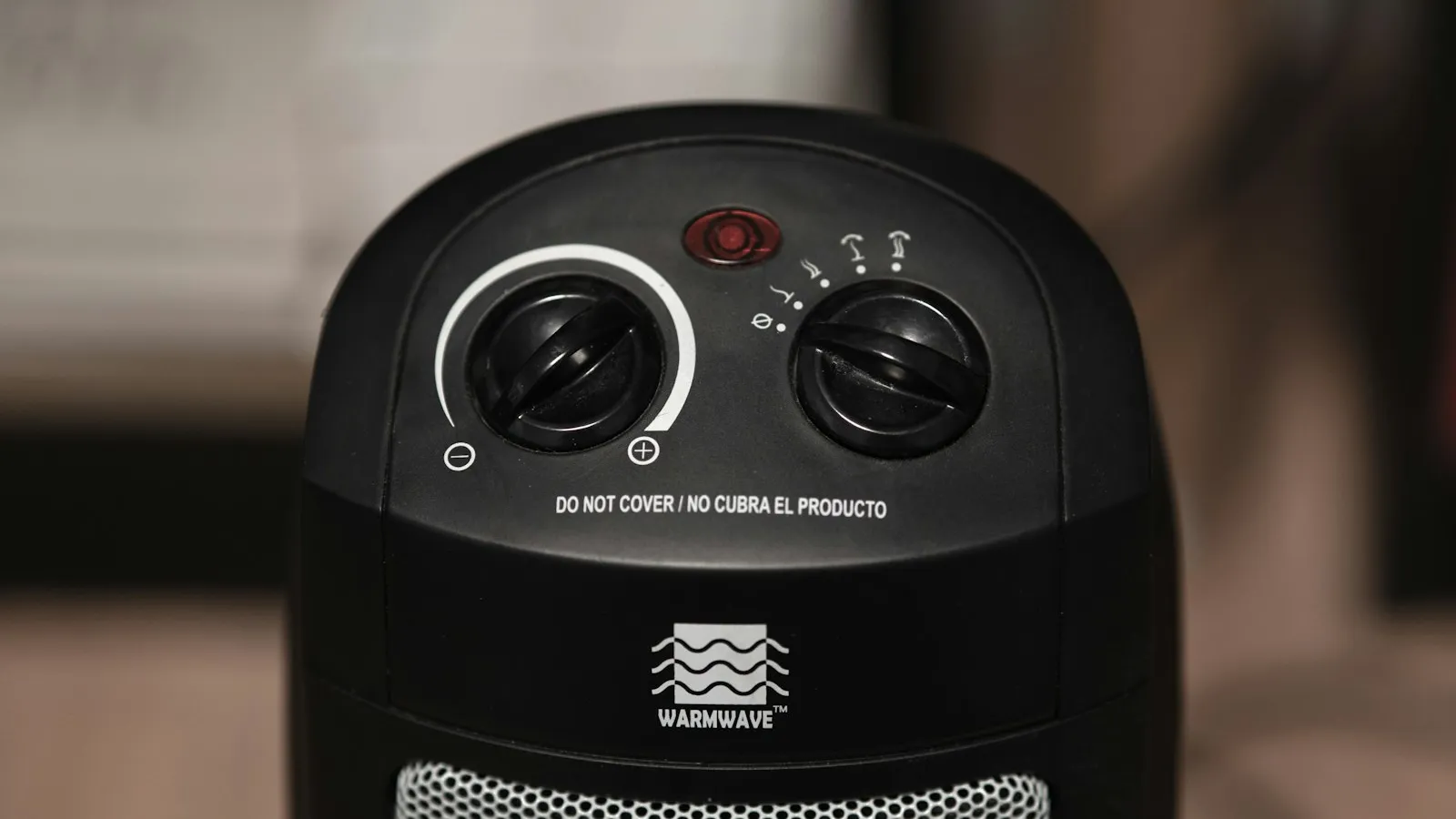 Close-up of the dials on a black space heater