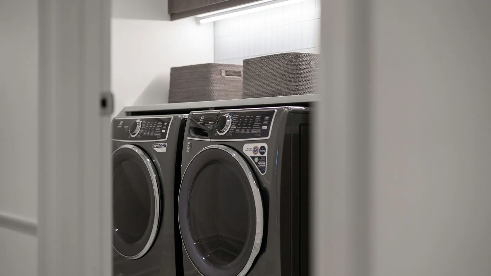 Modern laundry room with a matching washer and dryer